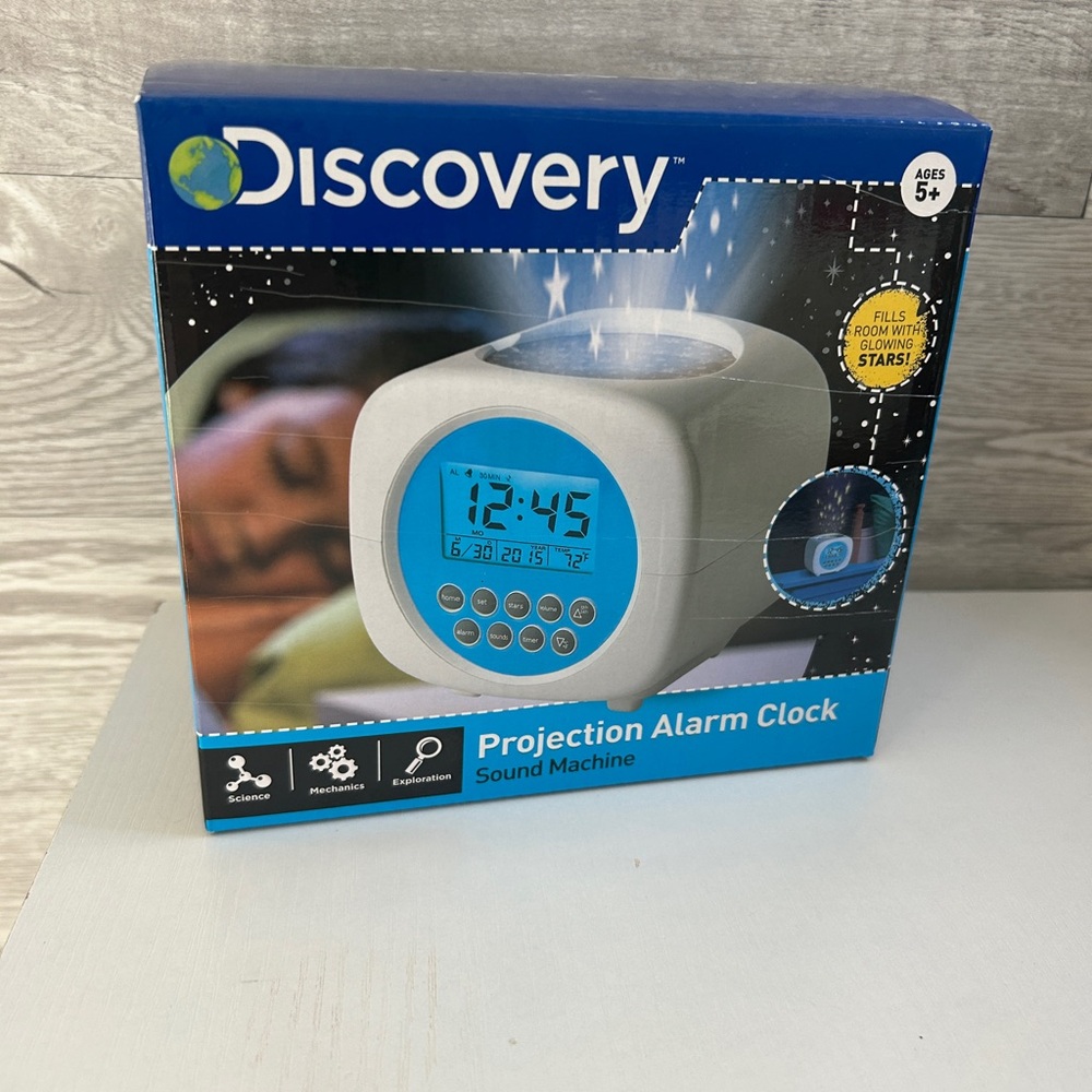 Discovery noisemaker light projector and alarm clock